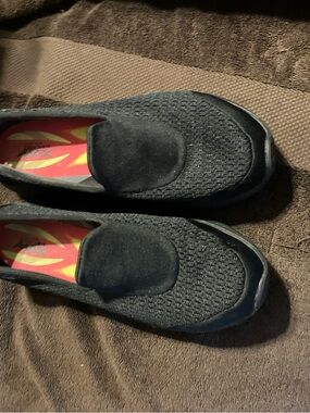 Skechers Black Knit Slip-On with Red and Yellow Insole